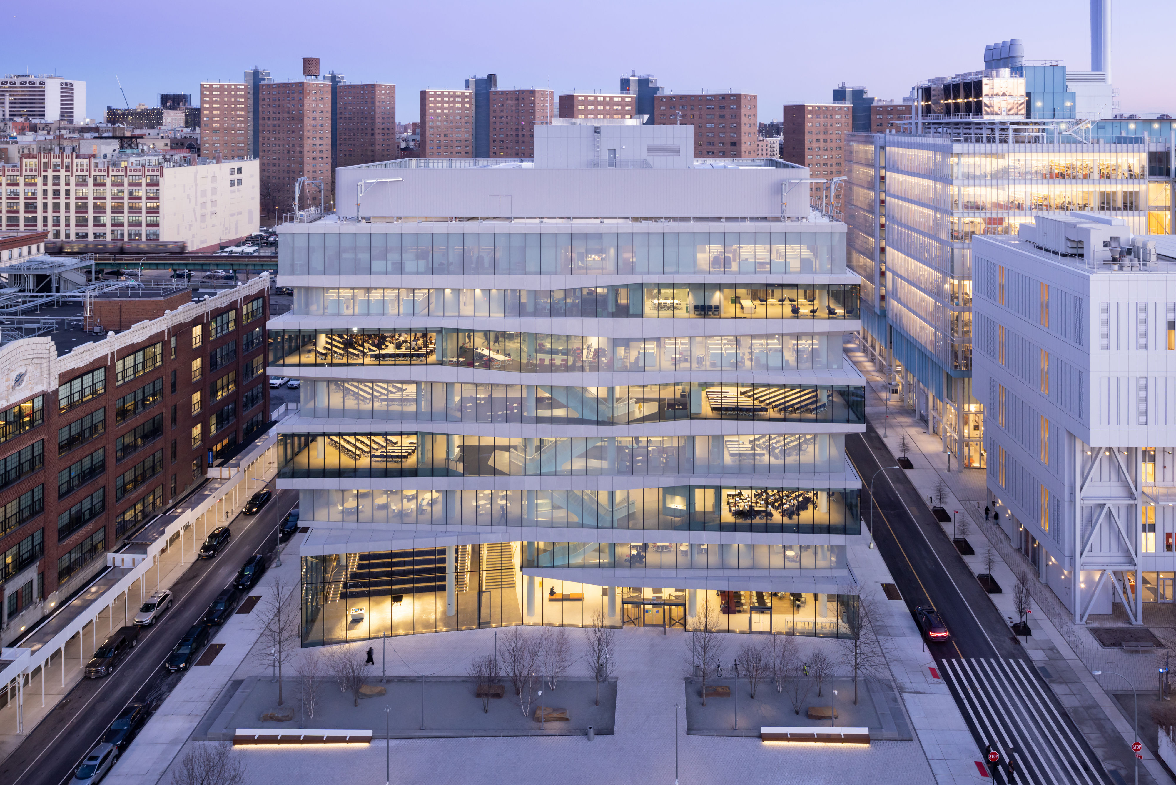 Kravis Hall, a tall building seen from afar at twilight