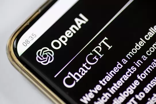 A closeup of a phone screen showing a ChatGPT interface