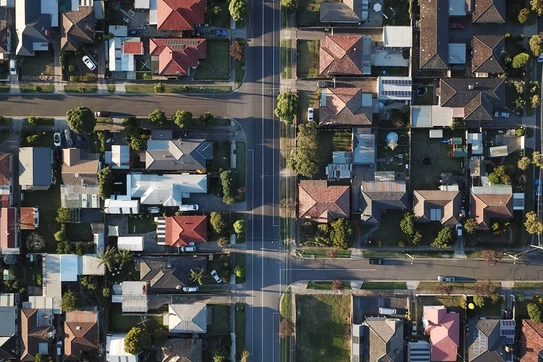 Aerial, overhead view of a neighborhood of single-family homes