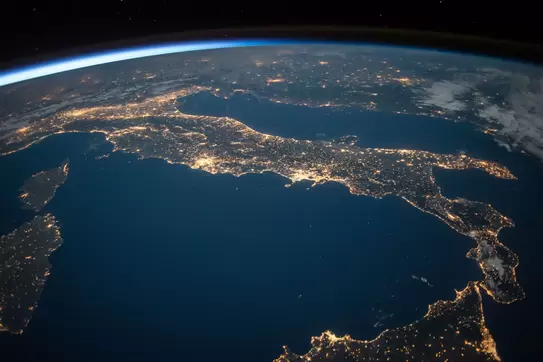 Earth Day Image displaying the globe with city lights