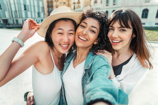 Three people take a selfie