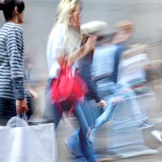 People walking with shopping bags