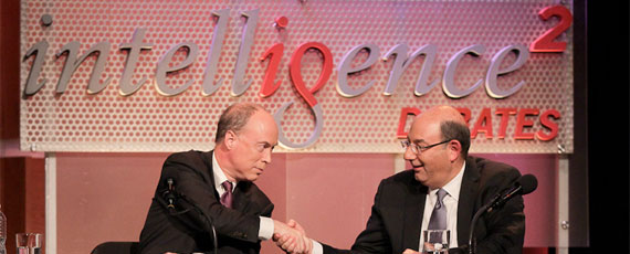 Debaters shaking hands on a stage